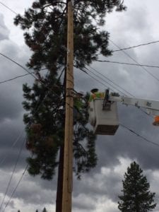 Comcast tech in a bucket truck