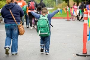 child with backpack