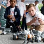 students driving small robots