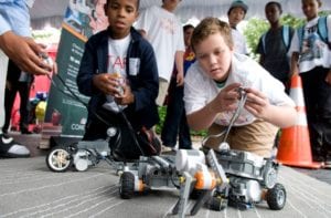 students driving small robots