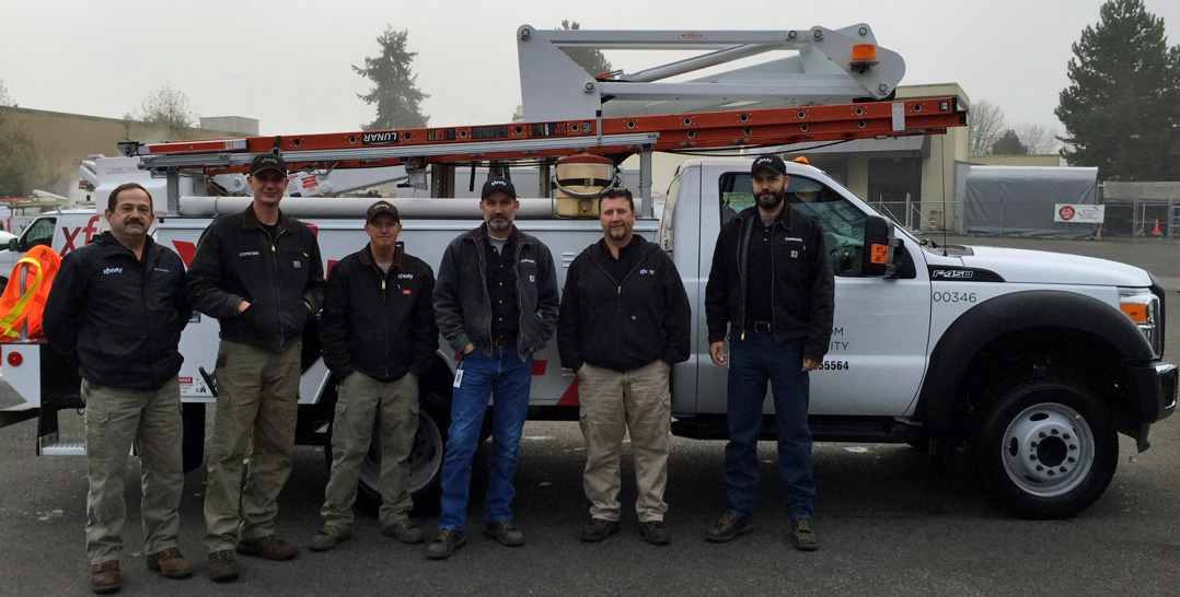 Techs standing by a truck