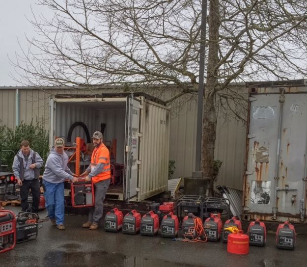 crew moving a generator