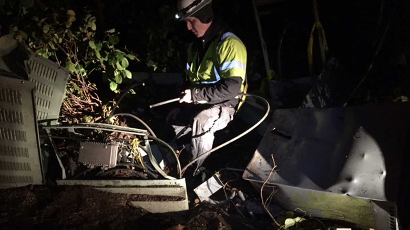 Man assessing wire damage