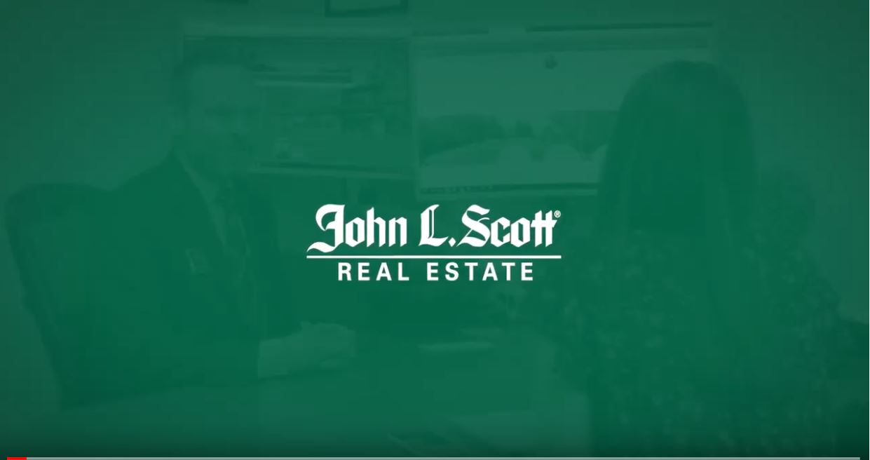 The John L. Scott Real Estate logo.