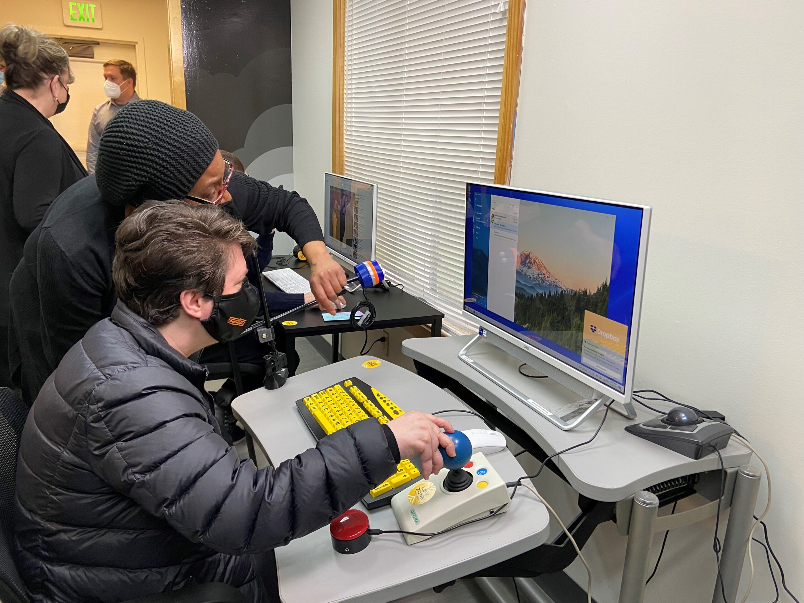 An Easterseals Instructor works with a Participant on a computer.