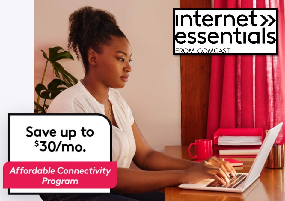 A woman types on a laptop computer.