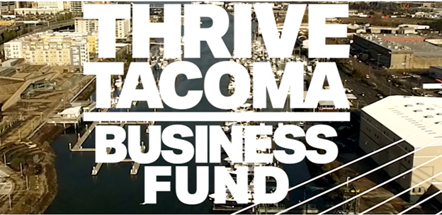 Thrive Tacoma Business Fund written over downtown Tacoma.