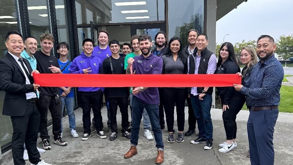 The employees of the Renton Xfinity store in front of the store.