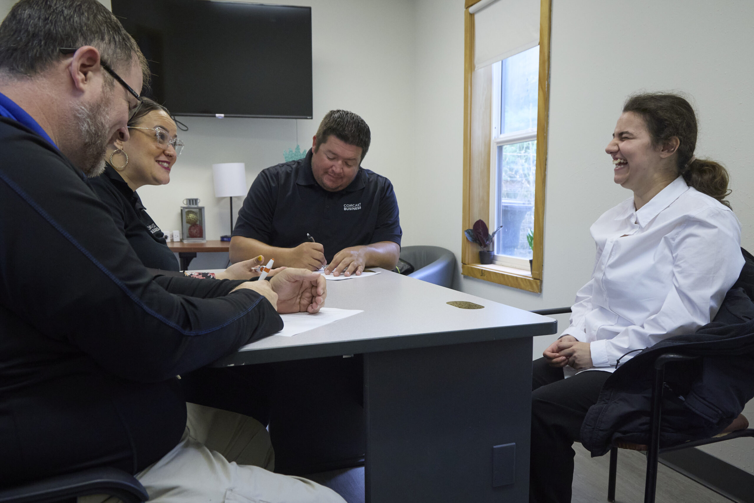 People sit around a table doing table.