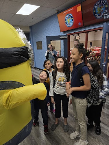 Children play with a Minion.