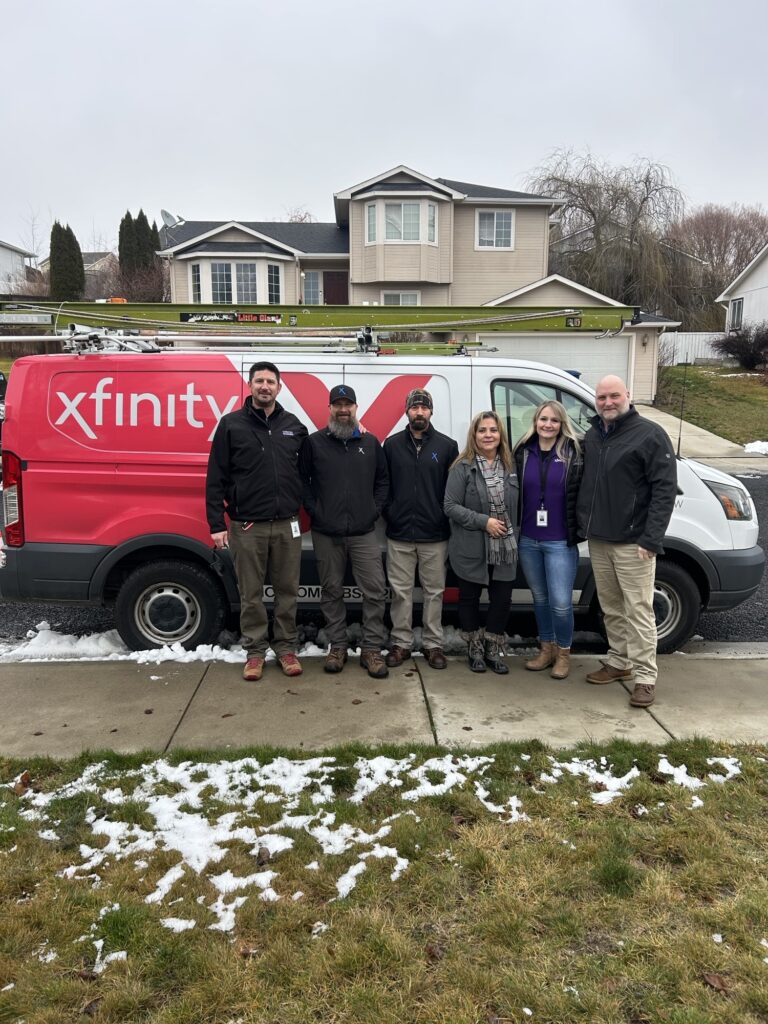 Dustin with Comcast employees. 