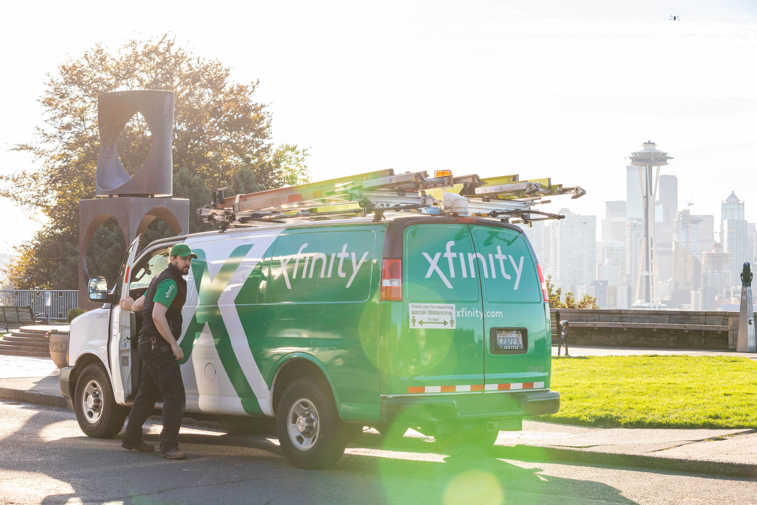 A Comcast technician by an Xfinity truck in Seattle.
