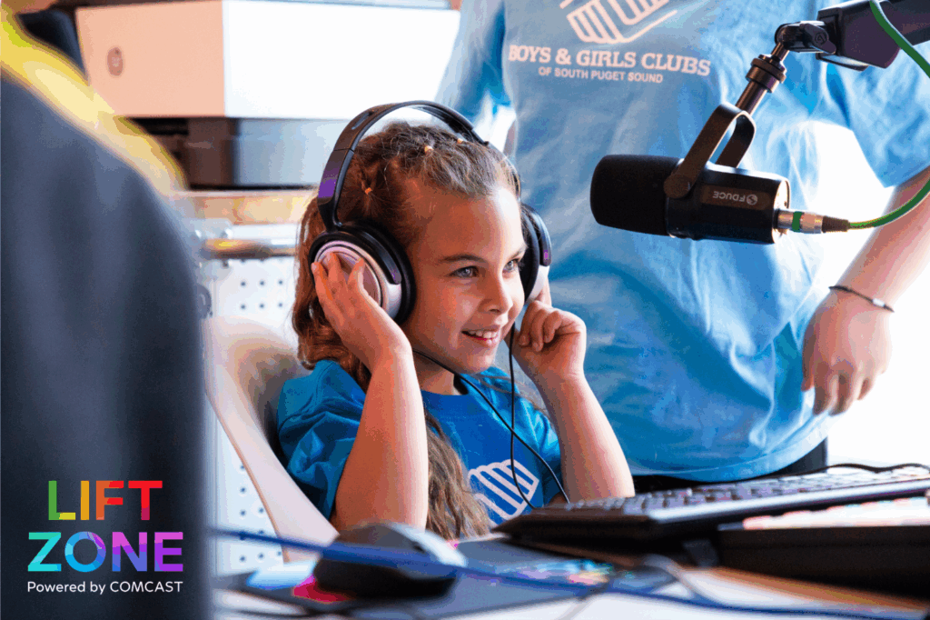 A Boys & Girls Club member wears headphones in the Lift Zone.