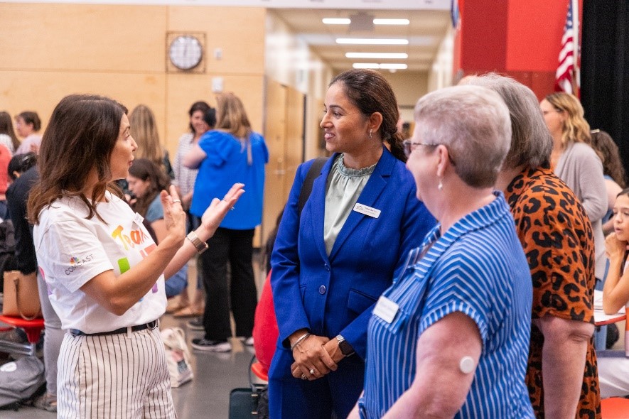 Teachers and Comcast reps at the Kent back to school donation event.