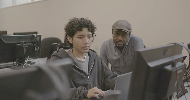 A Katy Tita student works with a Kay Tita leader.