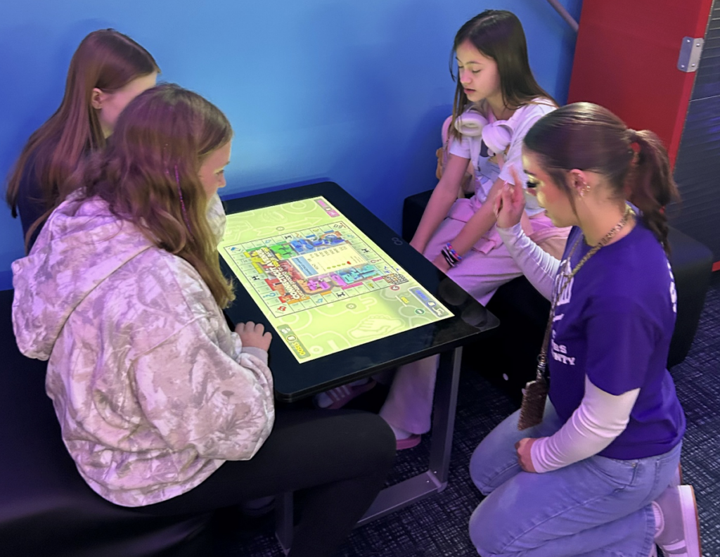 Young girls playing a computer game